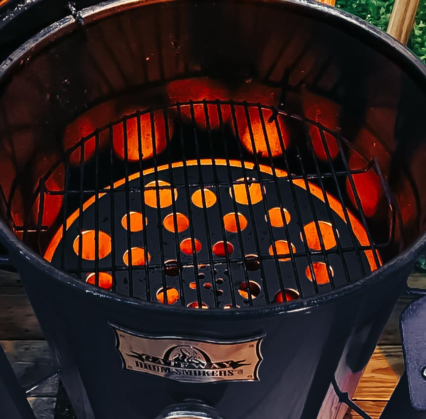 A heat diffuser plate in use on a 55 gallon Gateway Drum Smoker