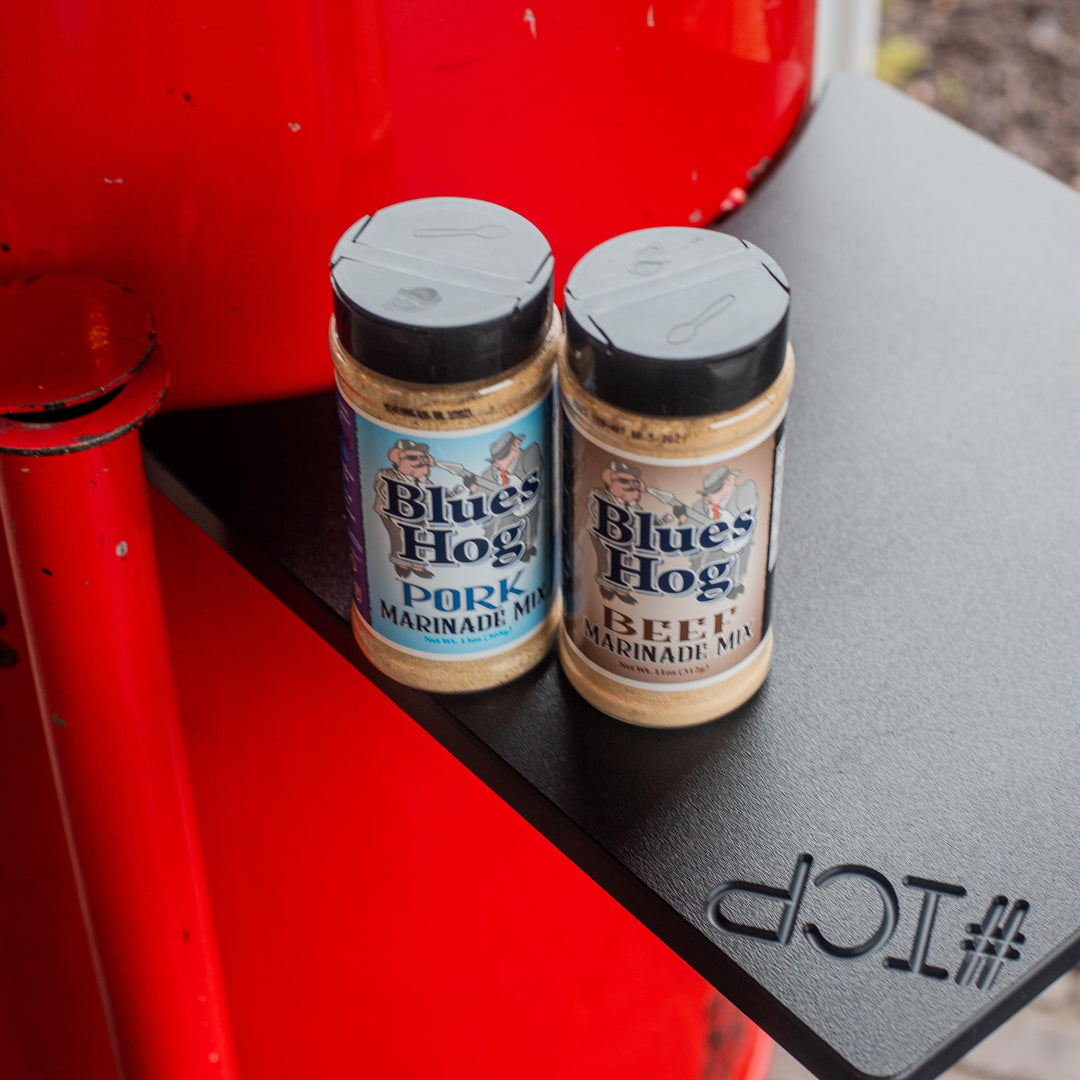 Side table shown in use on a 55 gallon Gateway Drum Smoker with a bottle of Blues Hog Pork and Beef Marinade